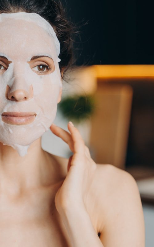 female-with-naked-shoulders-uses-rejuvenation-facial-sheet-mask-skin-treatment-at-home-skincare.jpg